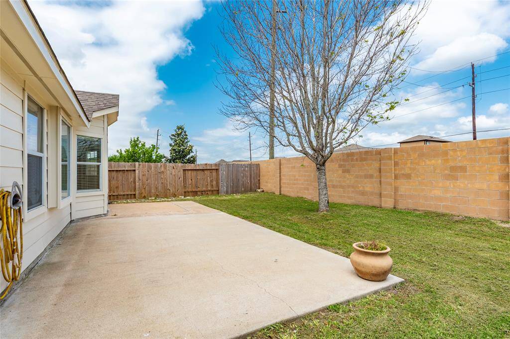 The back fence is brick for low maintenance, and the fence on the left is newly installed.