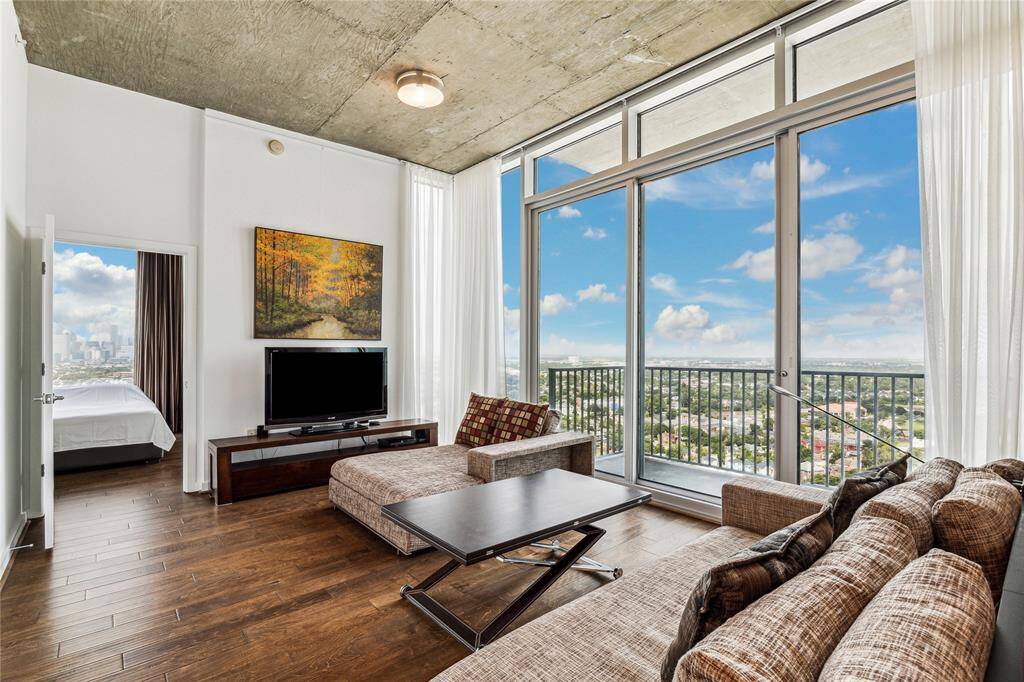 End unit that exudes luxury, perfect for entertaining guests as you welcome them into your elegant living room.