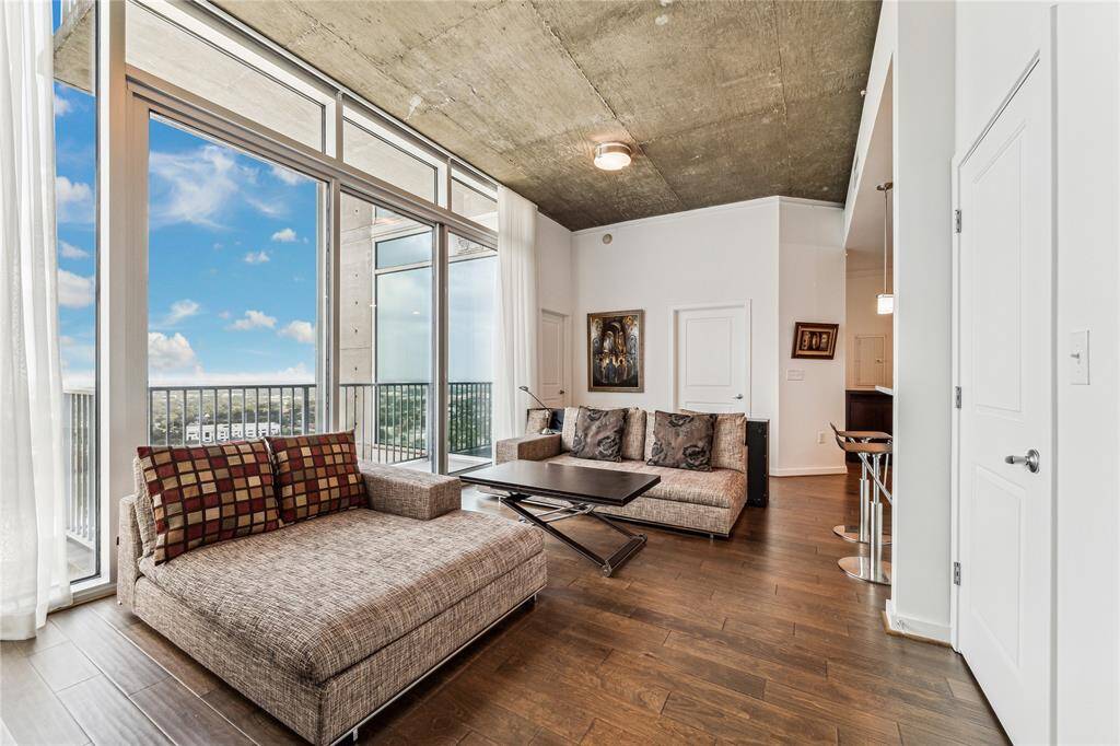 Discover luxury in this stunning residence, featuring floor-to-ceiling windows for abundant natural light and panoramic views. The spacious layout creates an open, inviting atmosphere perfect for modern living.
