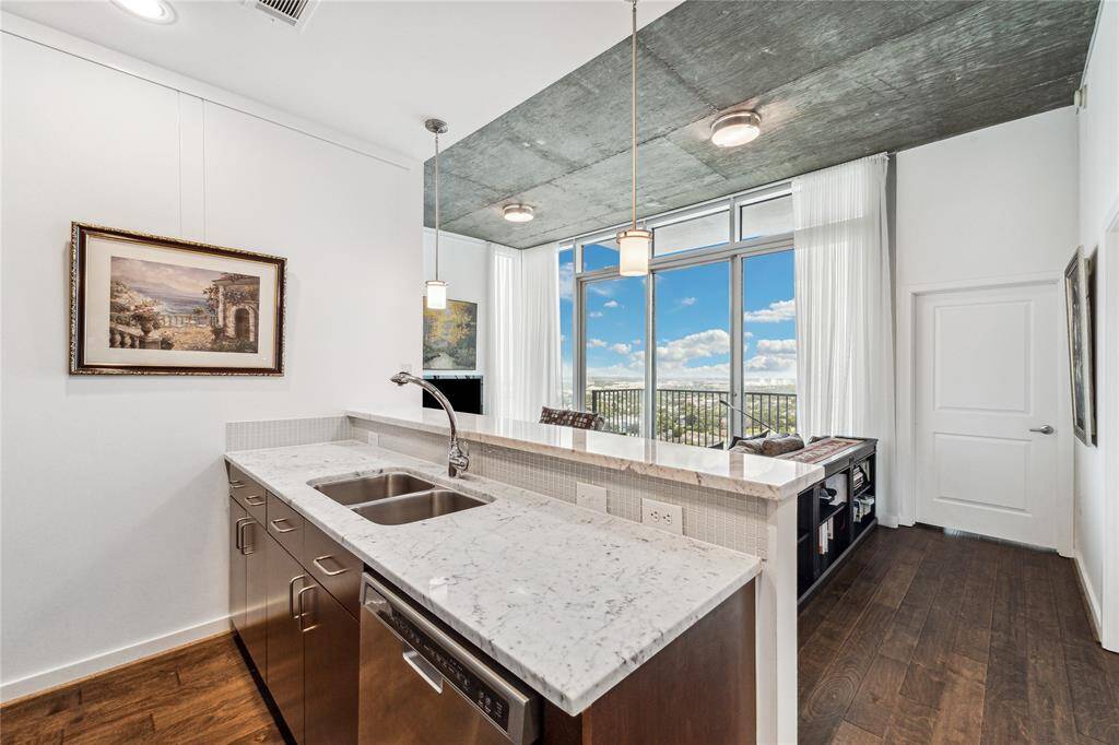 The kitchen opens to the inviting family room across a breakfast bar.