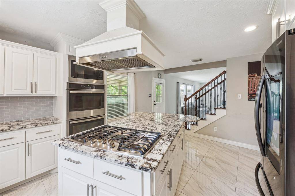 Alternate view of the kitchen that showcases plenty of counter top space