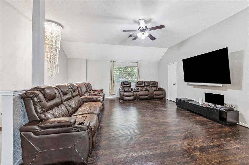 Spacious game room located right off the staircase.