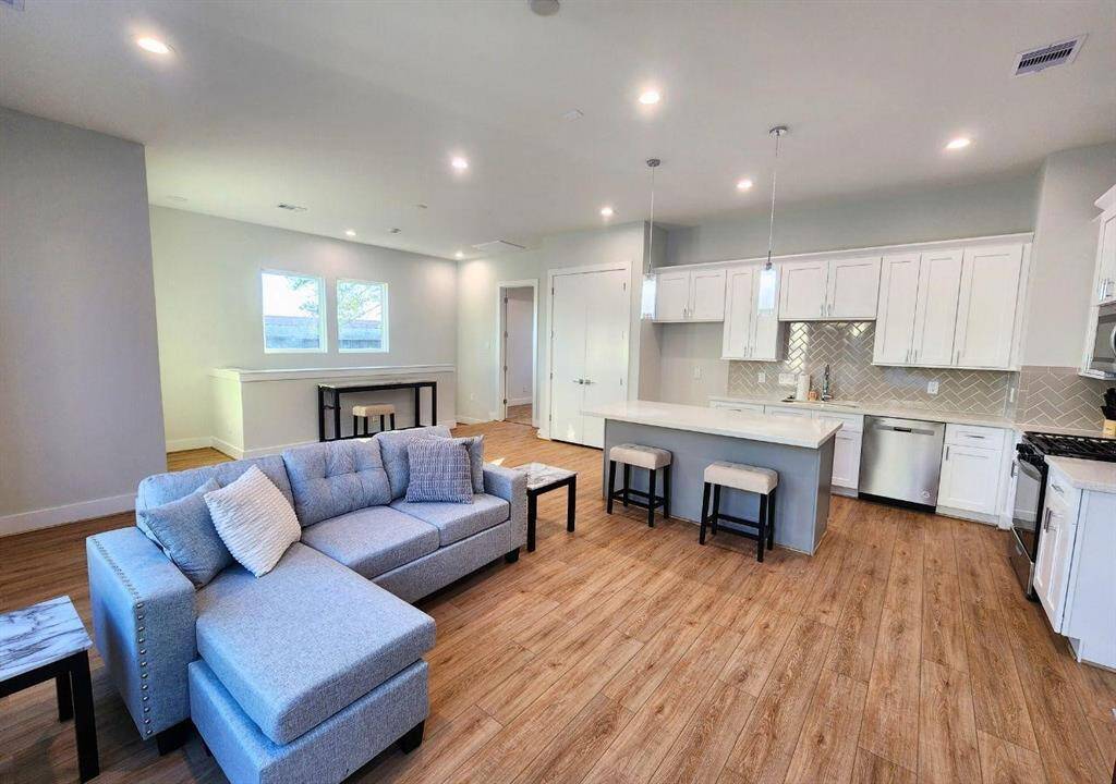 Island in the kitchen is perfect for morning breakfasts with access to living areas and just off the primary bedroom.