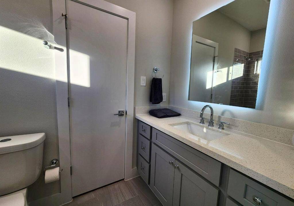 Pretty light counters and vanity area.