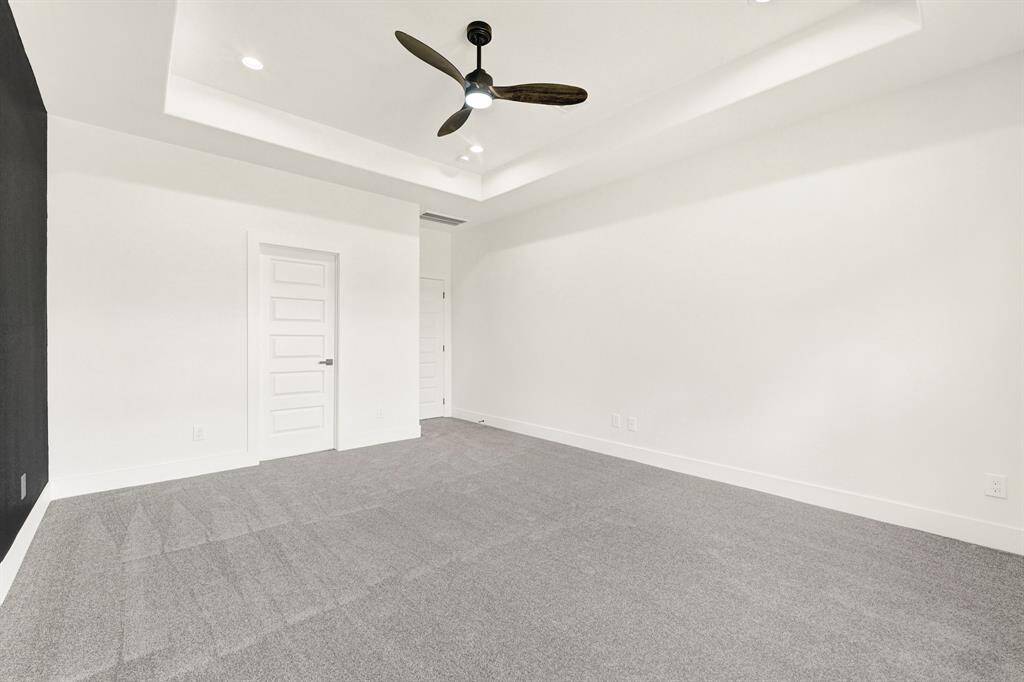 Spacious primary bedroom (digitally staged photo)