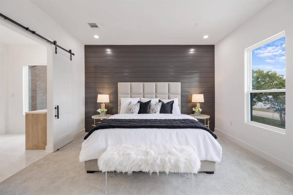 The expansive primary suite overflows with natural light.