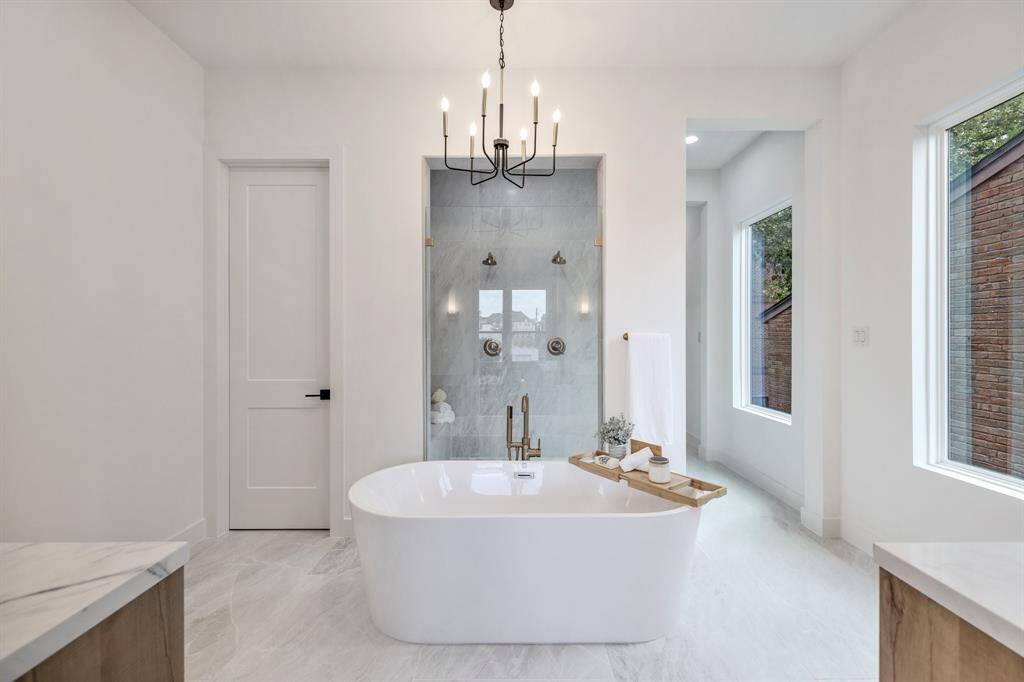 The primary bath is a true retreat.  Featuring his and hers vanities, free standing soaker tub and large shower with dual shower heads.