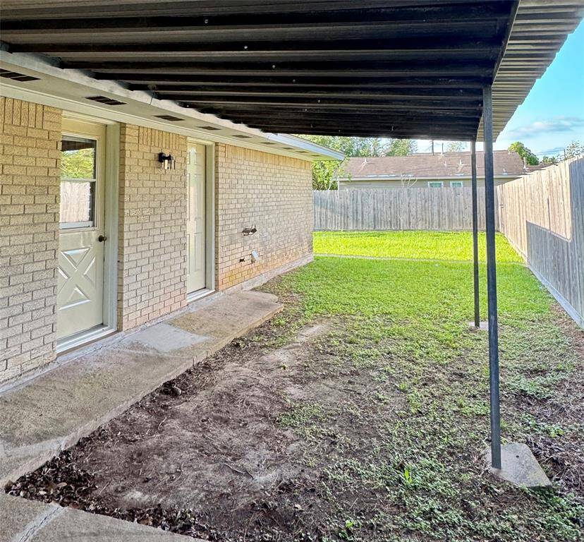 The partially covered backyard creates a versatile outdoor living space that’s ideal for Texas evenings. This area is perfect for hosting weekend BBQs, enjoying dinners under the stars, or just unwinding with a good book. There's plenty of room to add a patio set, string lights, or a grill!