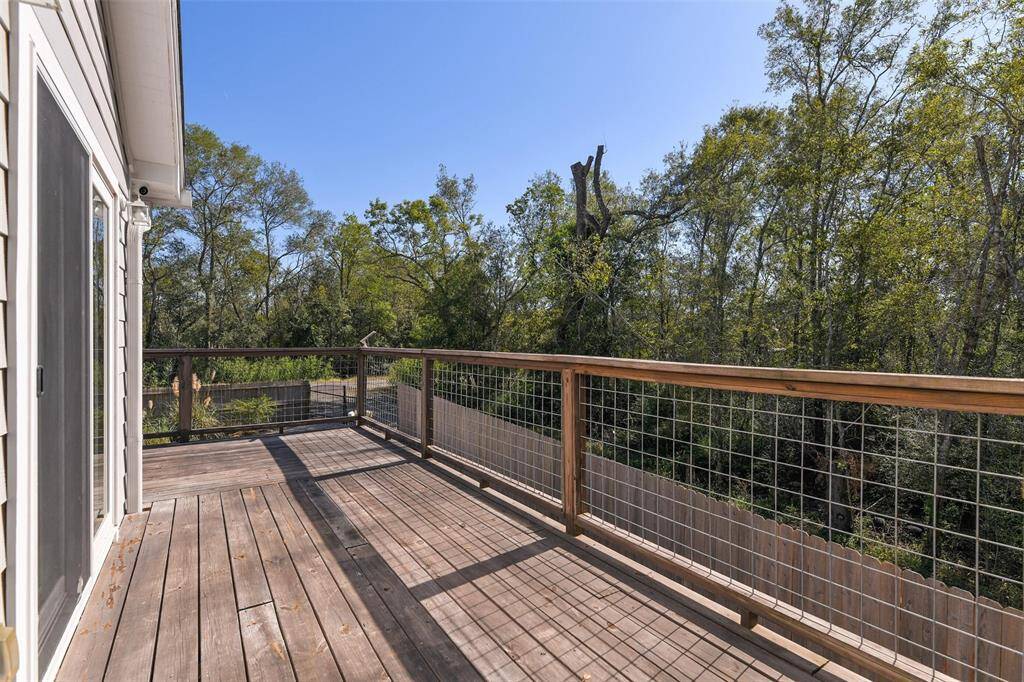 The porch offers a picturesque view of the surroundings, allowing residents and visitors to relax and enjoy the outdoors