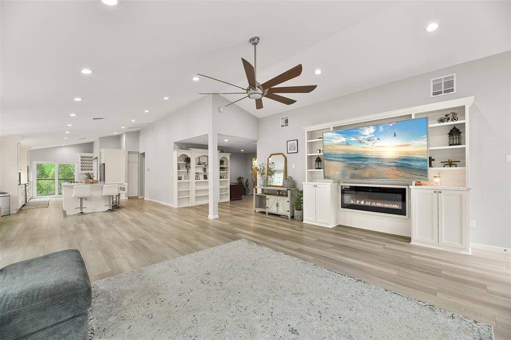 The high ceilings and strategically placed windows further enhance the sense of airiness and brightness throughout.