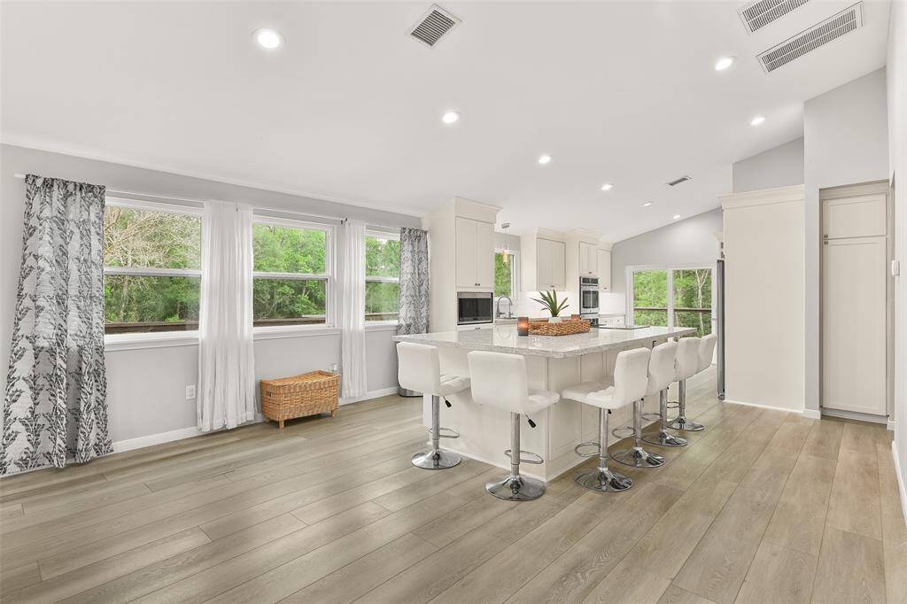 The abundance of natural light fills the space, creating an inviting and airy atmosphere.