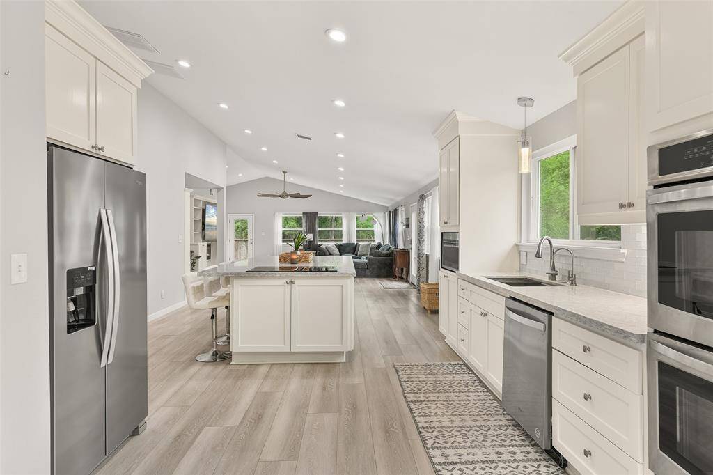 The heart of the home is the stunning kitchen, equipped with double ovens that will delight any culinary enthusiast.