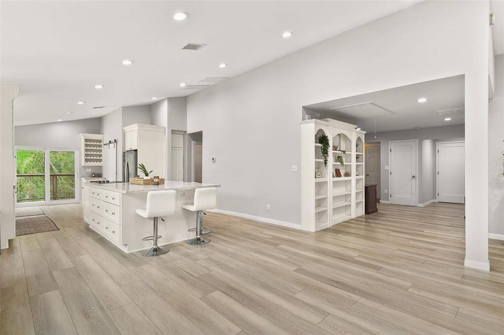 The absence of a traditional dining table allows for a spacious and flexible layout, giving you the freedom to create a dining experience that suits your lifestyle. Whether you prefer a minimalist aesthetic or want to experiment with different furniture arrangements, this open dining area provides a blank canvas for you to unleash your creativity.