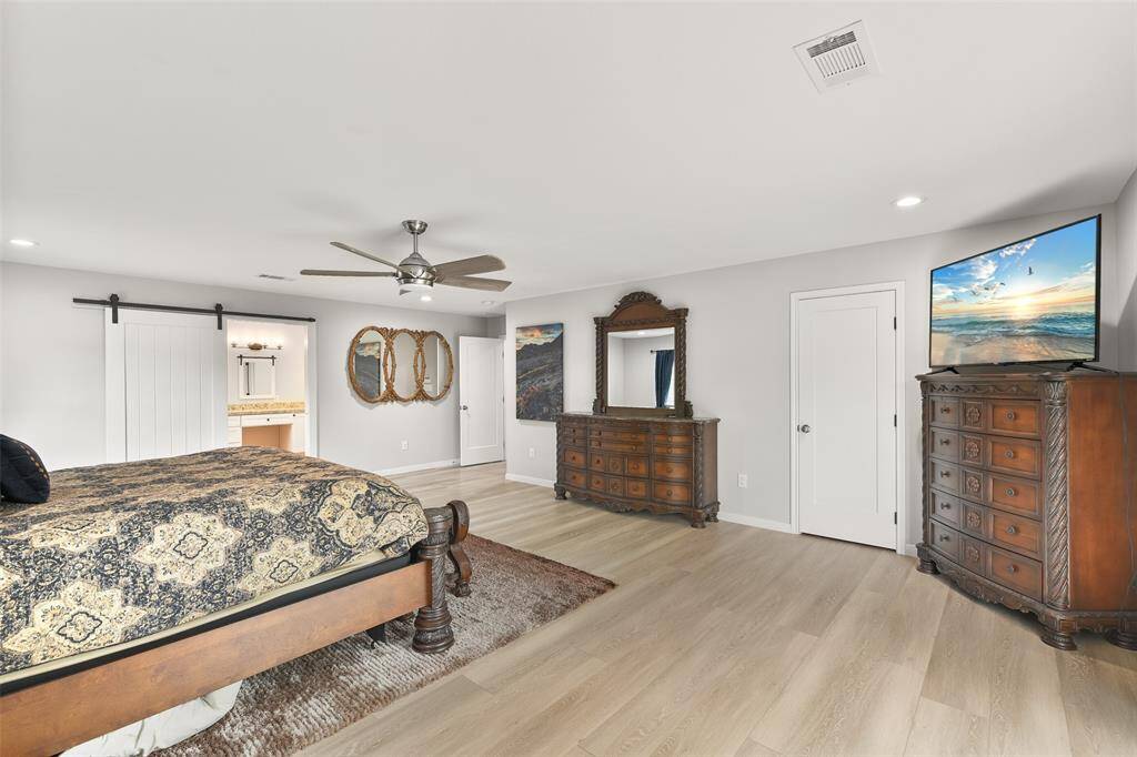 The primary suite is a luxurious and expansive space that is designed to accommodate oversized furniture and provide ample room for relaxation and comfort. It is a sanctuary within the home, offering privacy and a sense of tranquility.