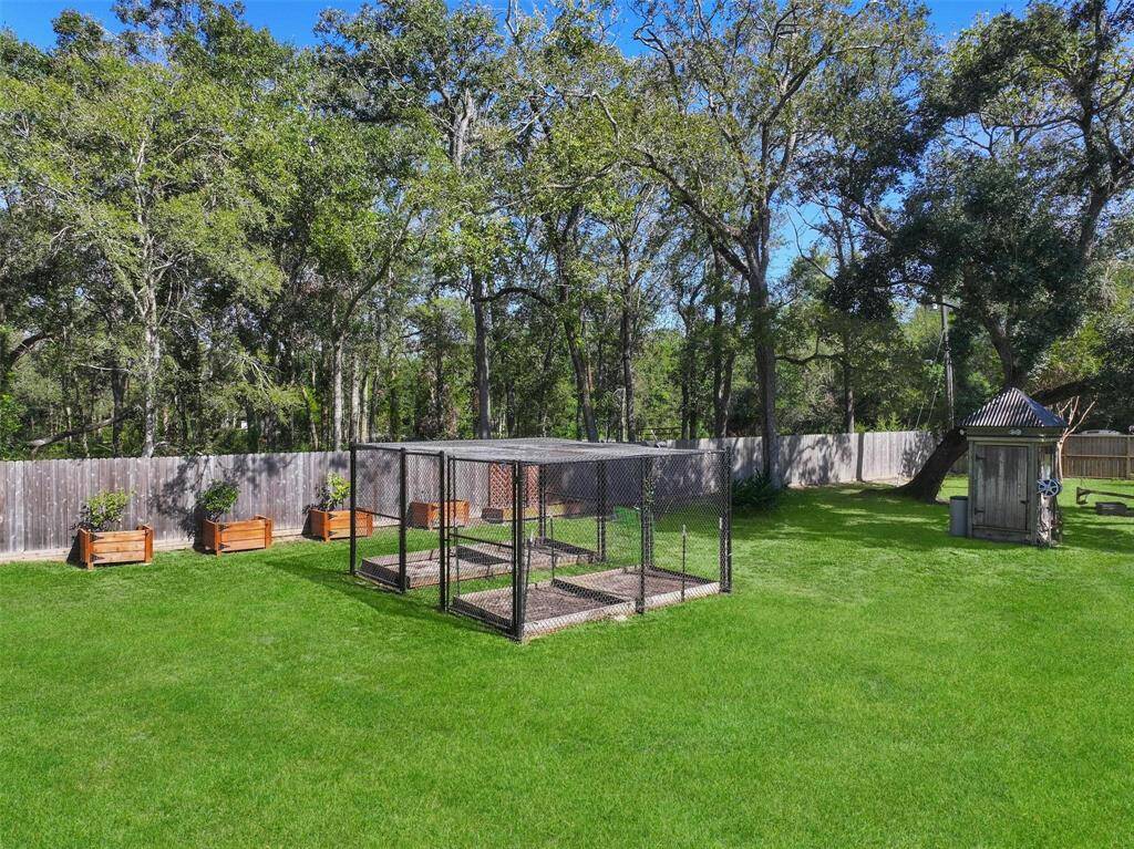 For those with a green thumb, a well-maintained garden area awaits, featuring built-in raised beds for all your gardening endeavors.