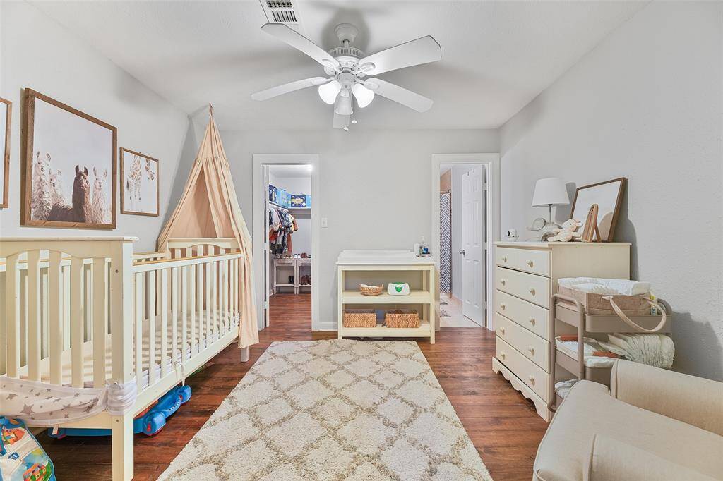 Adorable baby's room complete with a spacious walk-in closet and a convenient full-size bathroom, offering both comfort and convenience for your little one.
