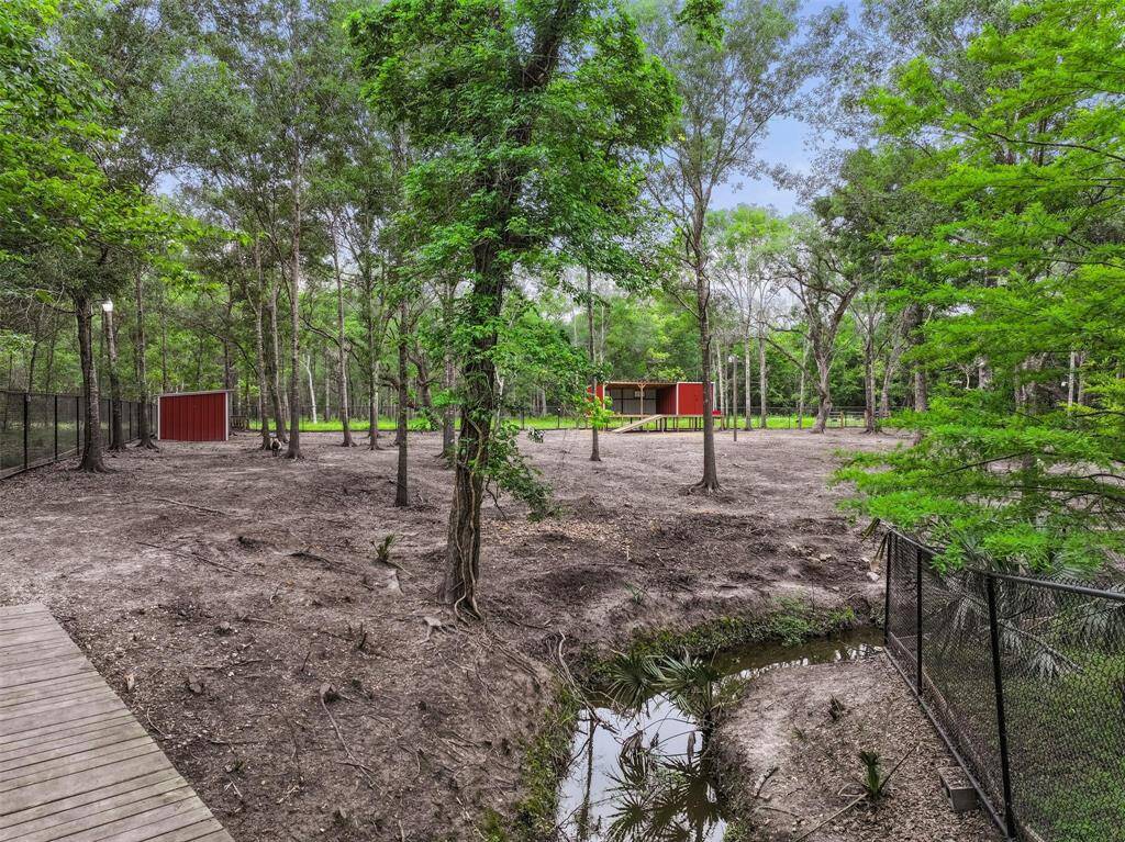 A 6-foot chainlink fence encloses the animal area, complete with lights and water access.