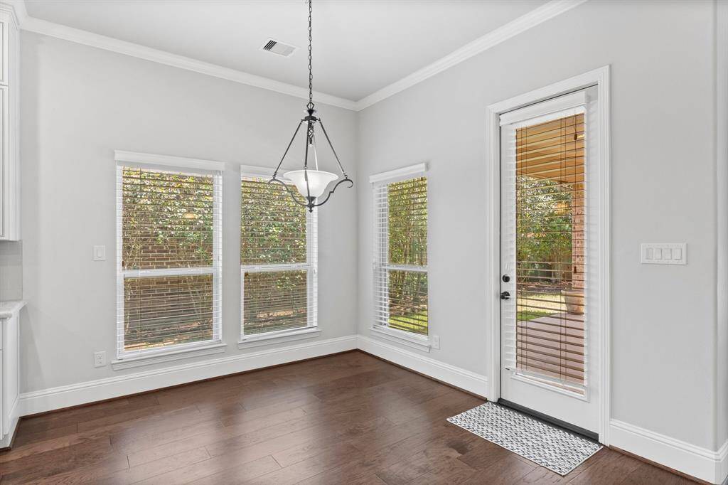 Bright breakfast area with door leading to the covered patio.