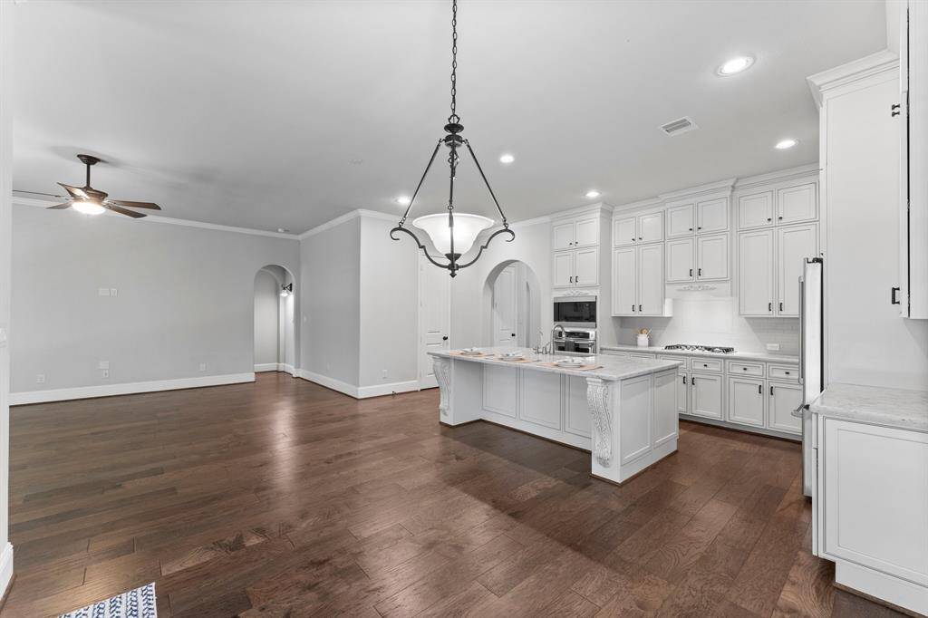 Spacious open-concept living area blending seamlessly with dining and breakfast spaces for effortless entertaining and daily comfort.