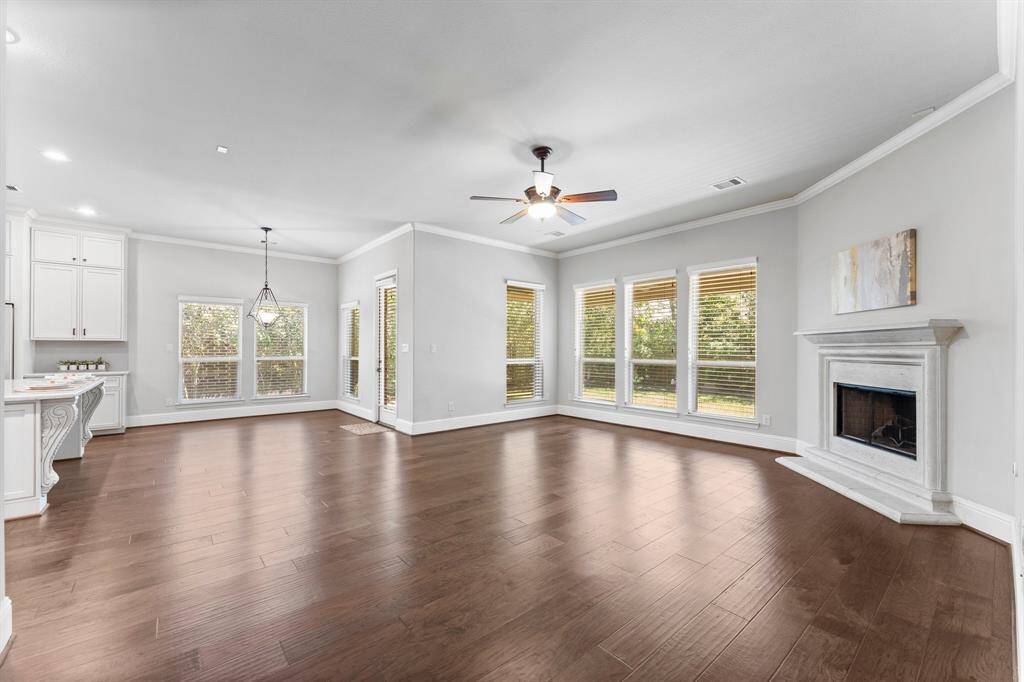 Flooded with natural light through expansive wall of windows.