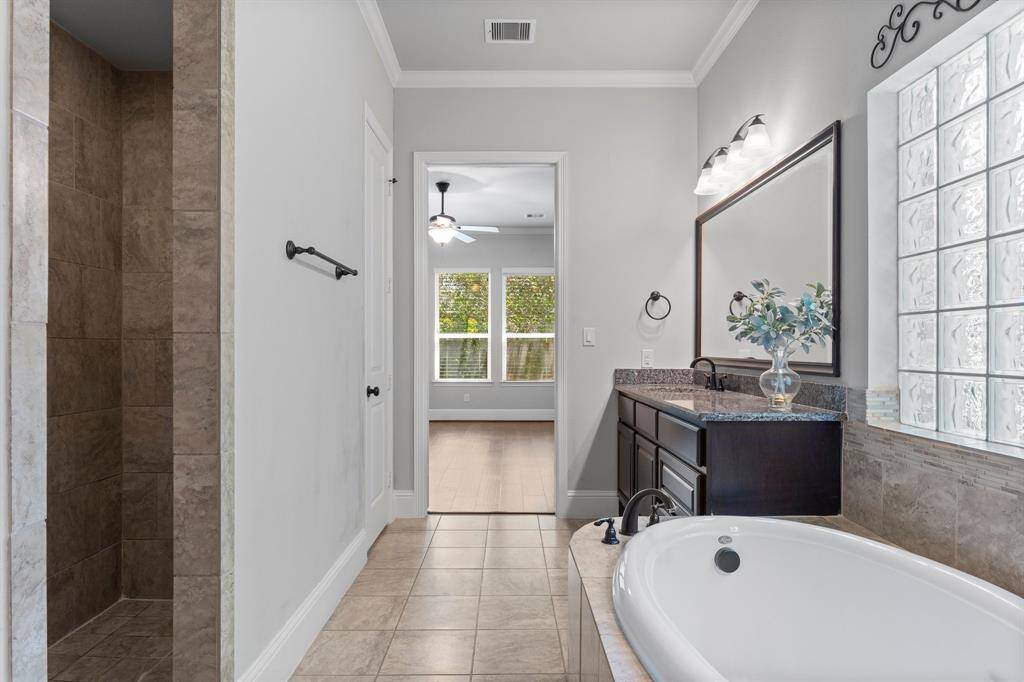 Indulge in tranquility in this elegant bathroom, perfect for unwinding after a long day.