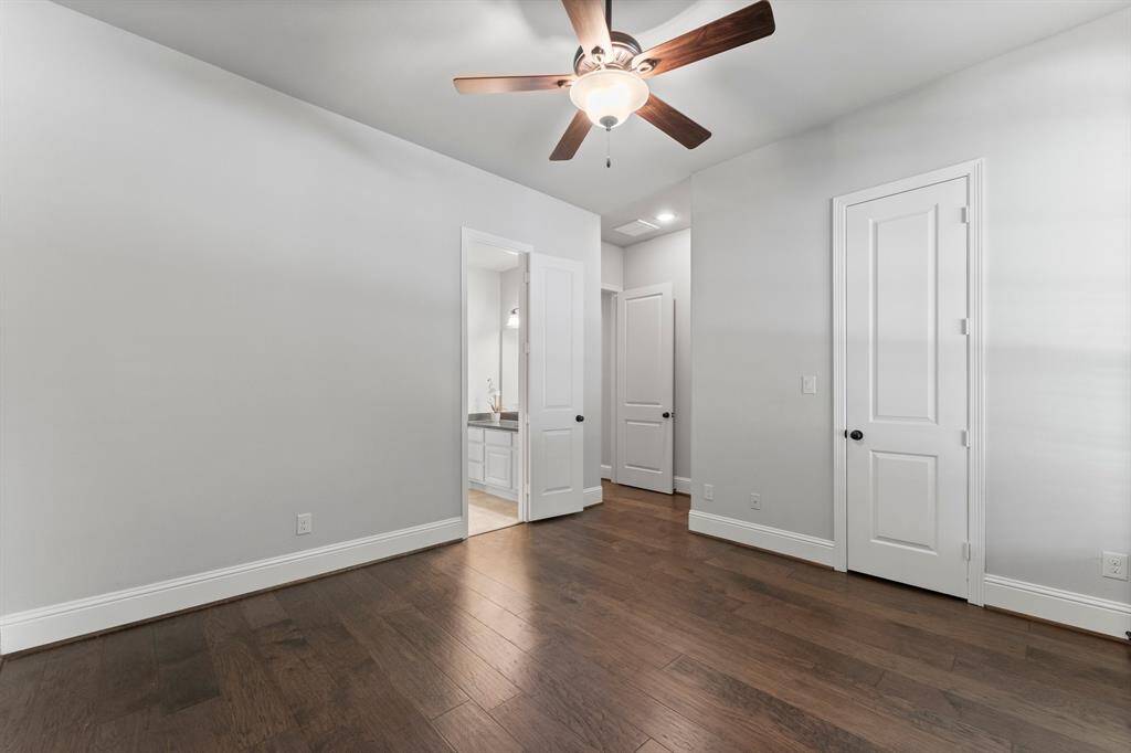 First bedroom features a spacious walk-in closet and direct bathroom access.
