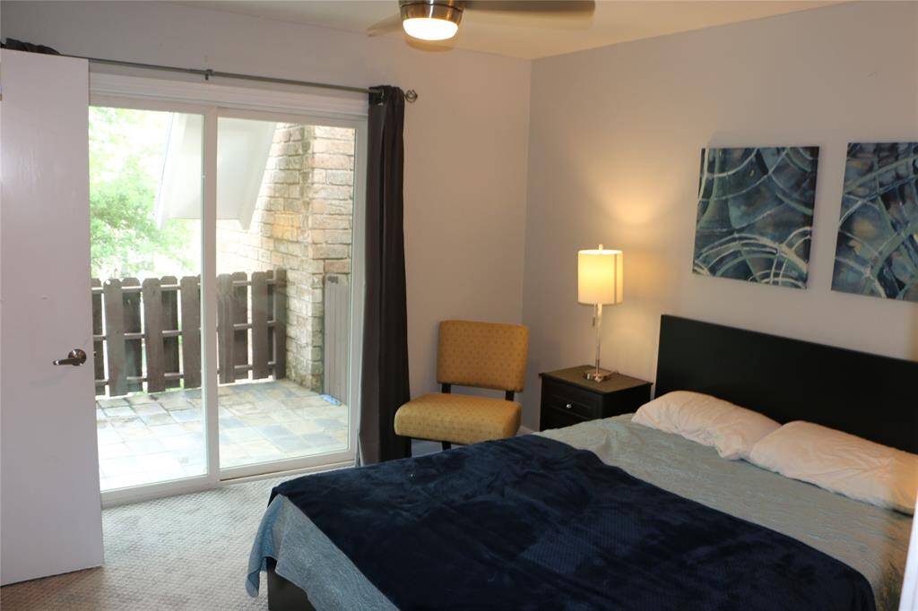 Guest bedroom has private balcony with views of the marina and harbor