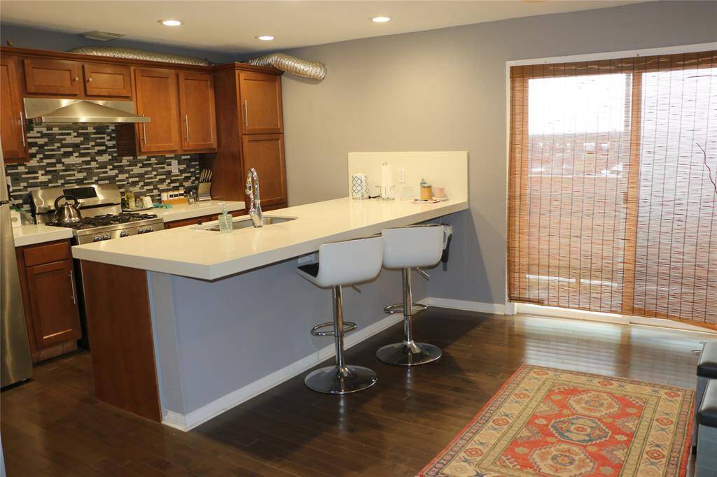 Lovely kitchen with ample cabinetry. Quartz countertops in kitchen. Dining room is adjacent with incredible views of the marina