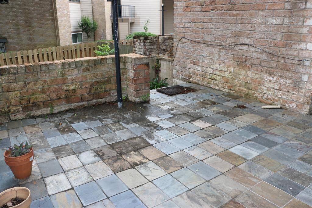 patio just off the living room has tile and over 10 foot ceilings