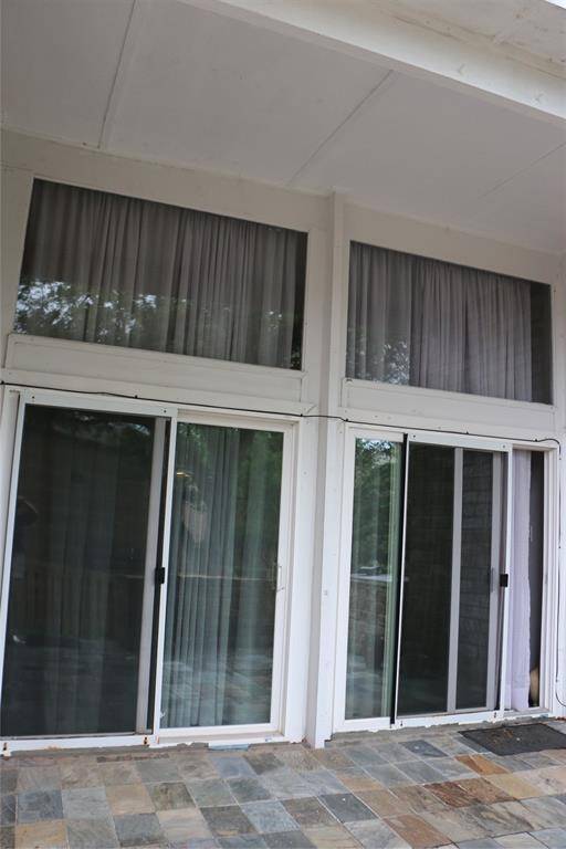 Sliding doors allow much natural lighting into condo