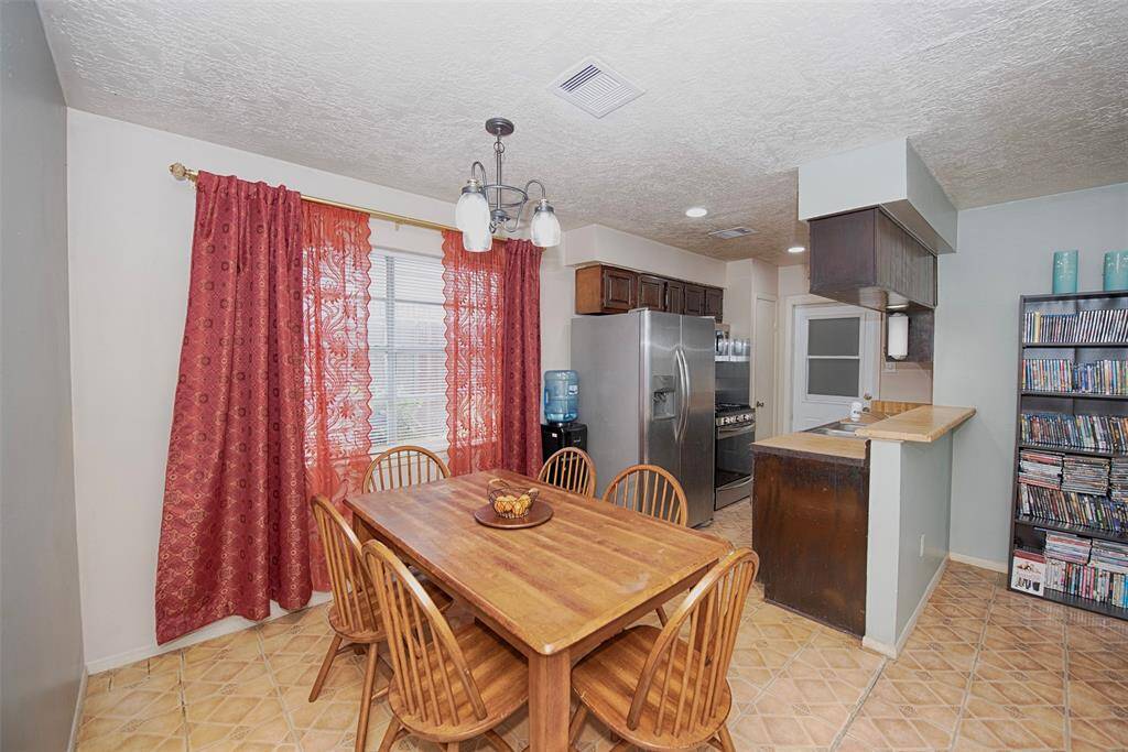 Off of the family room is a spacious dining area for your family meals and entertaining.