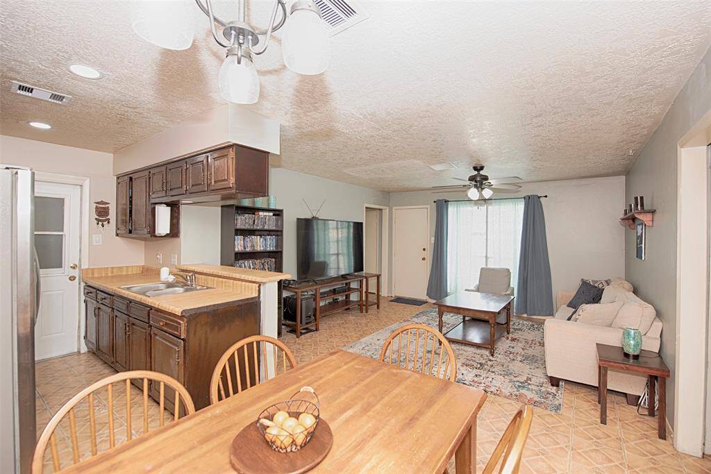 A view of the spacious dining area open to just the kitchen but the family room as well