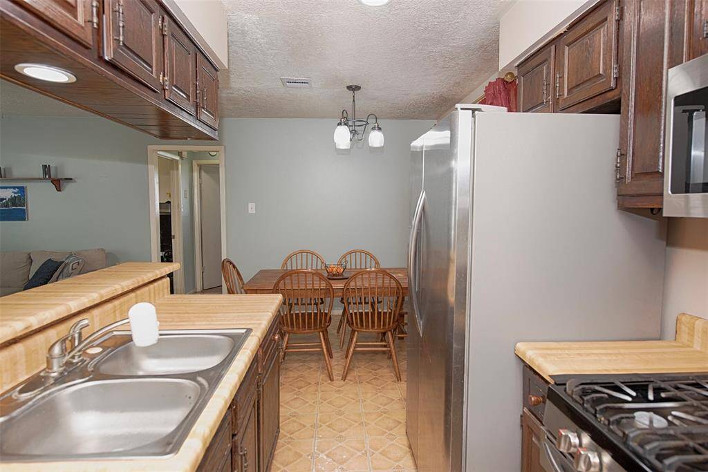 A view of the kitchen showing the easy access to the dining area.