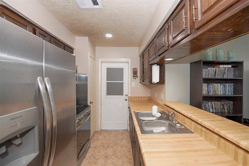 A view of the kitchen from the dining area. The fridge actually stays for the lucky new owner.