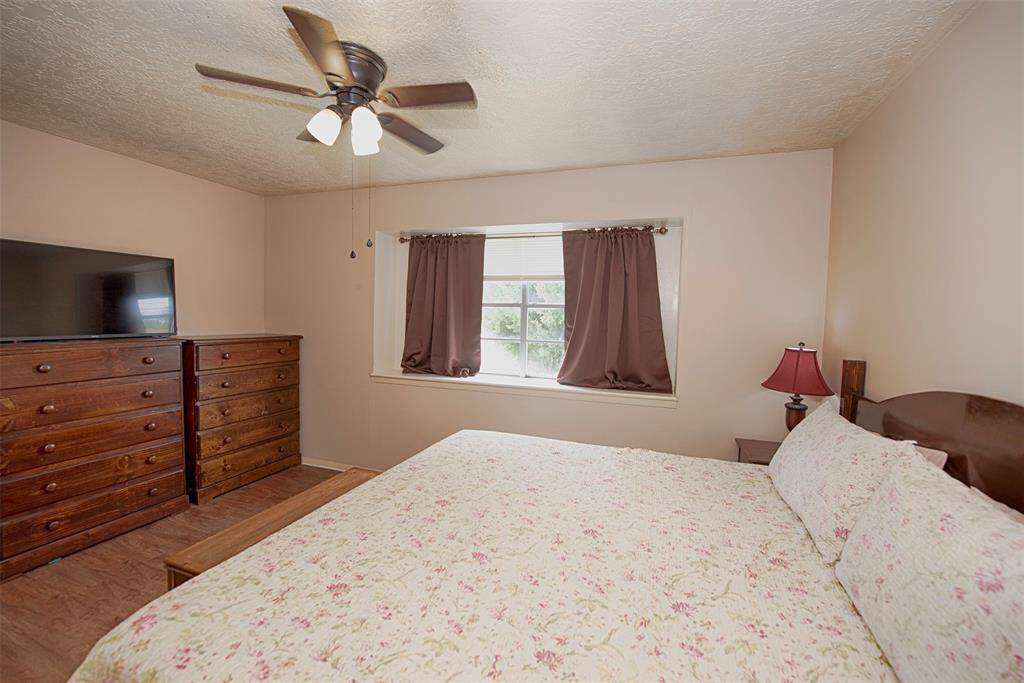 Another view of the primary bedroom showing the great space.