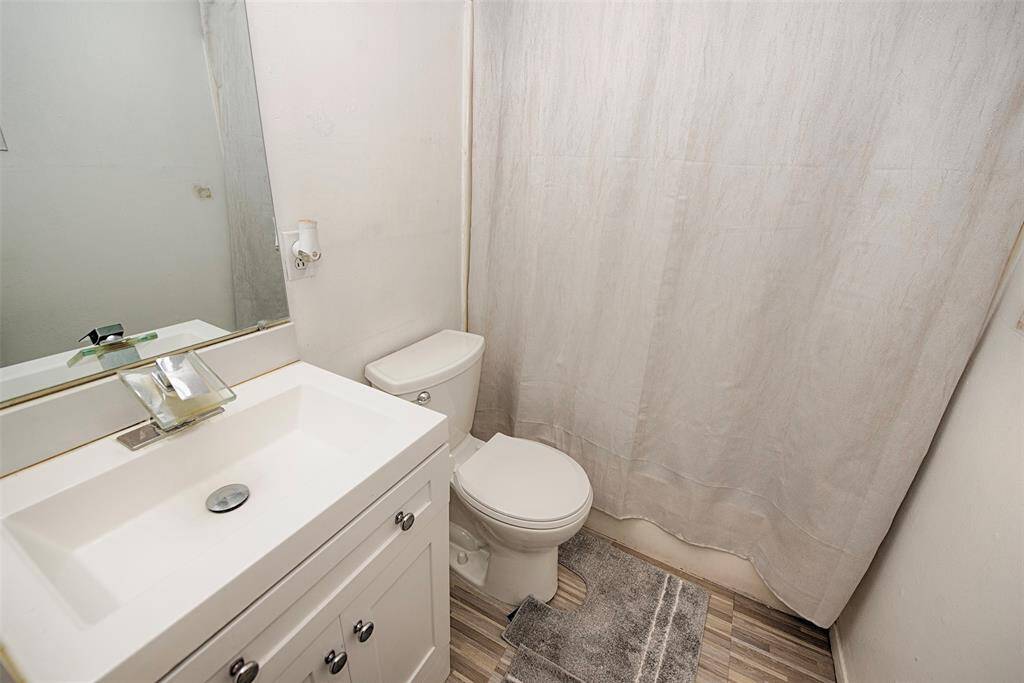 The extra bathroom is conveniently located between the additional bedrooms.