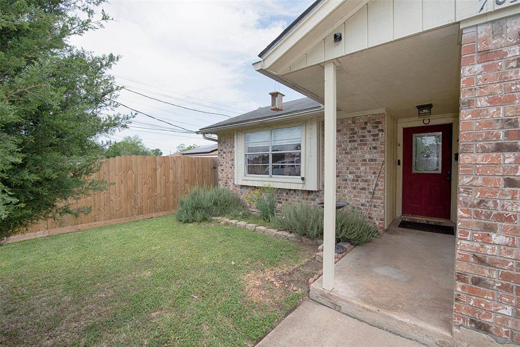 The front porch accented by amazing rosemary bushes.