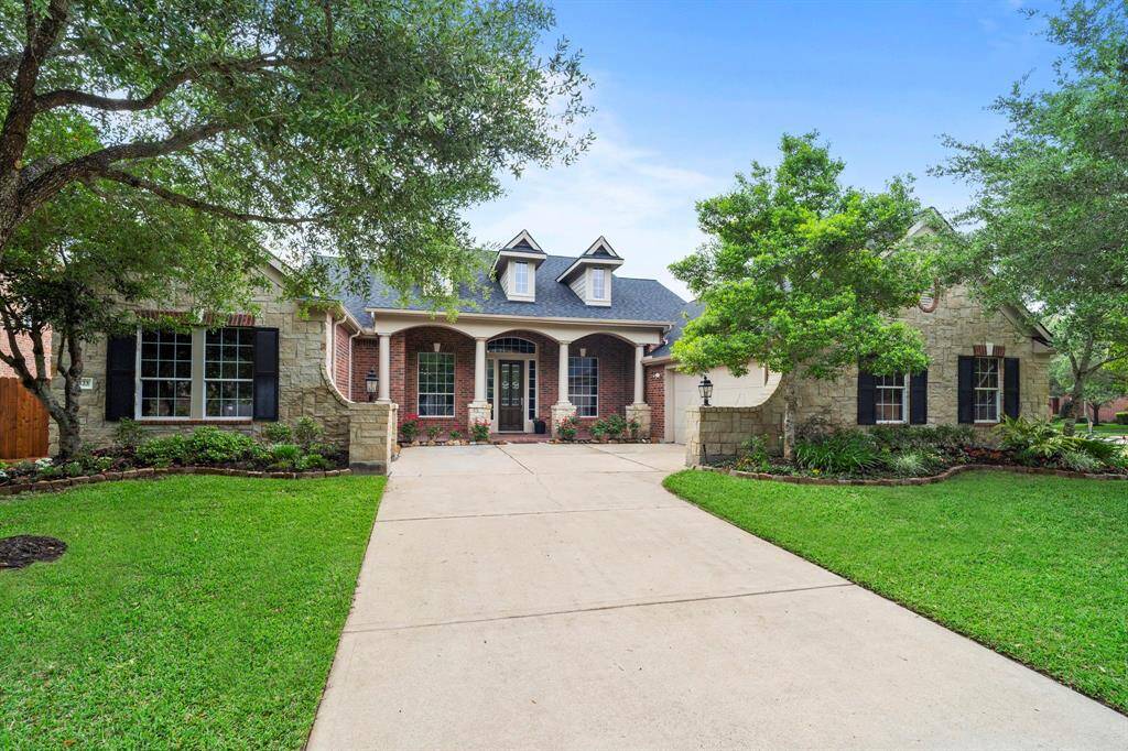 Charming one-story brick home on a prime 17,282 sq ft lot in exclusive Brookside at Riverstone neighborhood.
