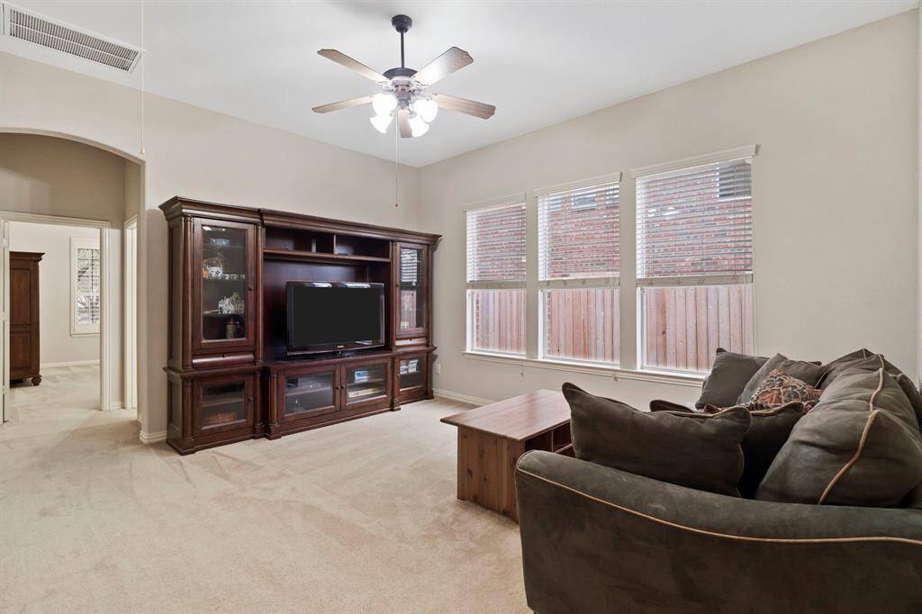 The game room is perfectly situated between two secondary bedrooms—ideal for a playroom or second living area.