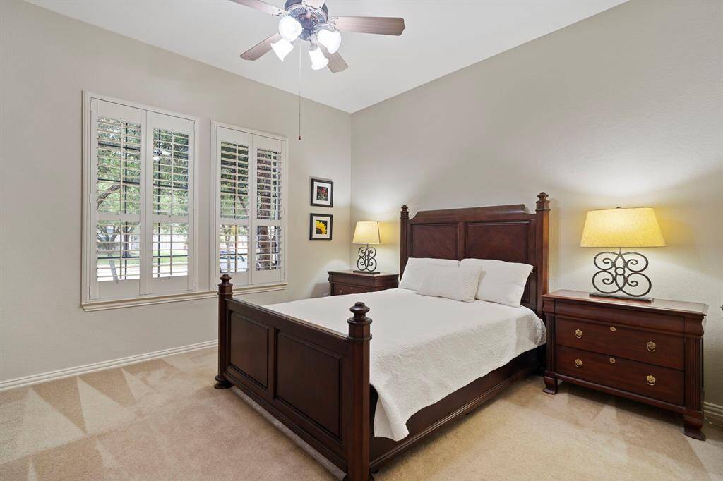 Another secondary bedroom boasts a large window with plantation shutters, with a full bathroom and walk-in closet conveniently located right outside. New AC installed in this home in 2018.
