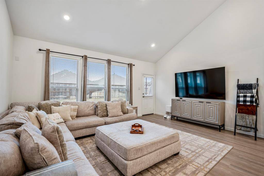 This spacious living room flows seamlessly into the rest of the home.