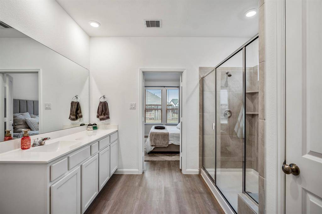 A reverse view of this primary bath. Door to the right is the utility closet.