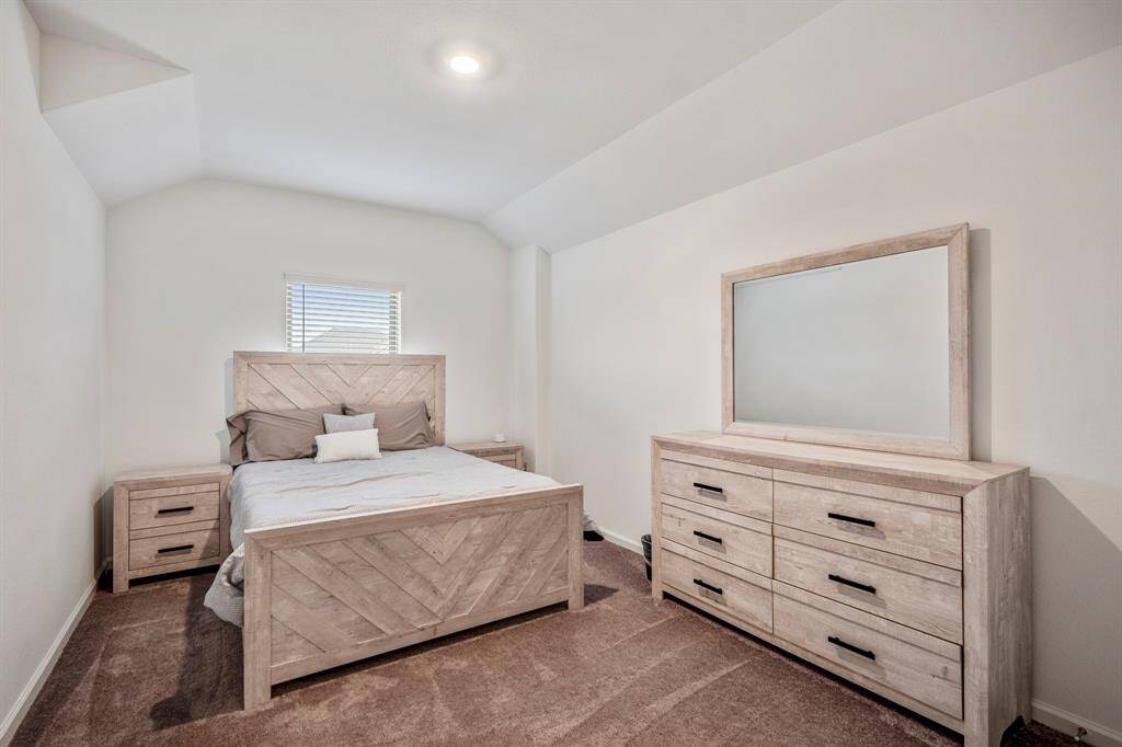 One of two secondary bedrooms upstairs.