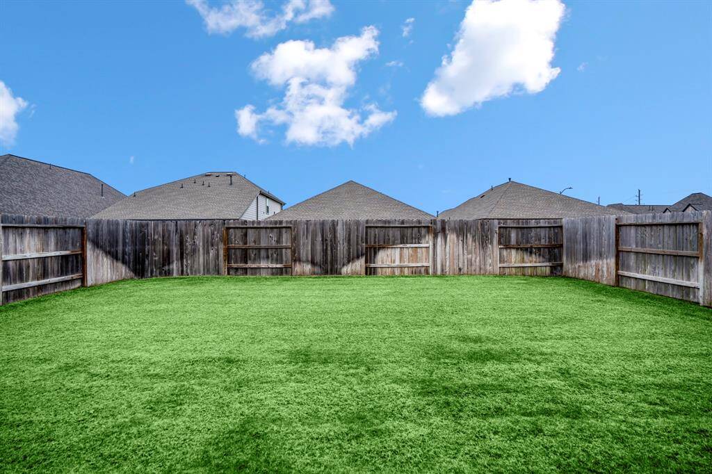 Large yard for a pool and playground equipment.