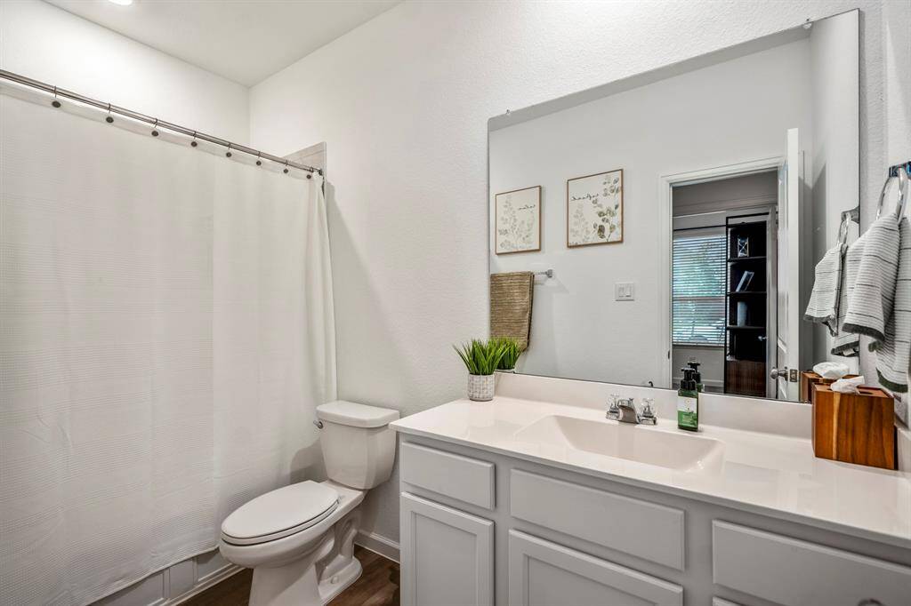 Full bathroom in this hallway just outside the first-floor bedroom.