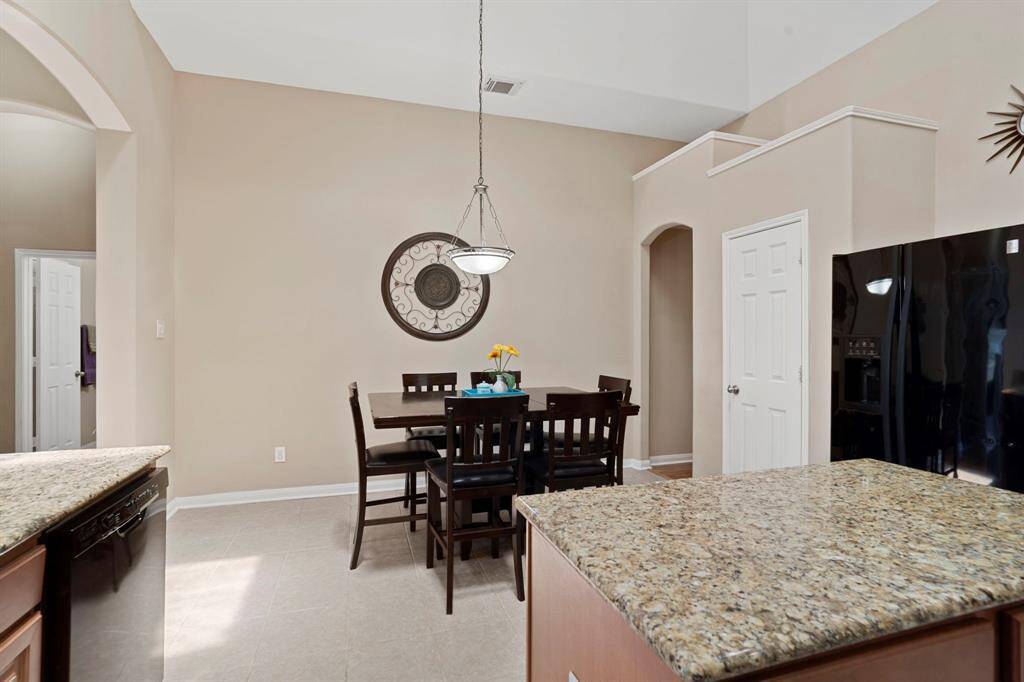 A pantry between the kitchen and breakfast area is easily accessible and provides ample storage.