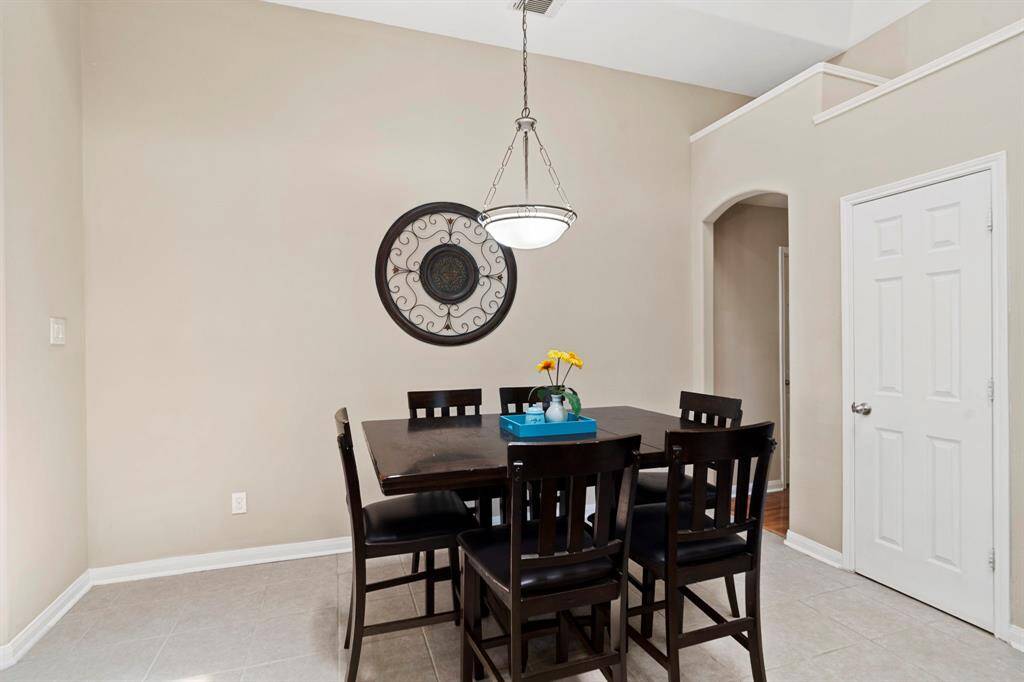 The spacious breakfast room easily accommodates a large table, making it ideal for casual meals and everyday gatherings.