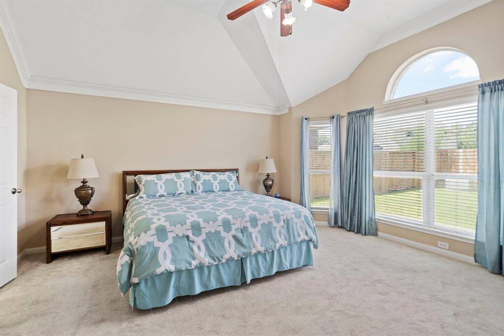 The private owner’s suite is tucked away at the rear of the home and offers peaceful views of the backyard.