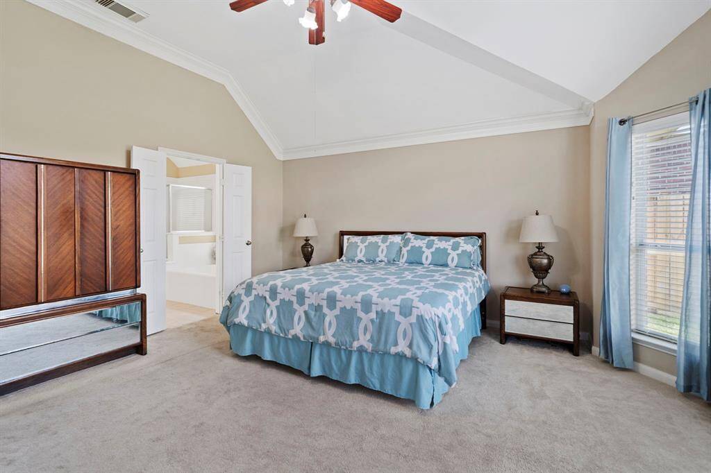Double doors lead into the en suite bathroom, offering a private retreat within the owner's suite.
