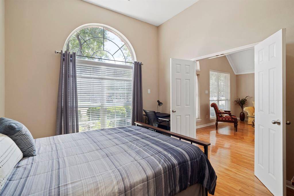The home office is currently being used as a fourth bedroom, and features an additional entrance next to a full bathroom.
